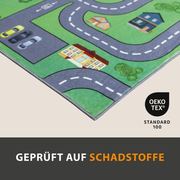 Spielteppich mit bunten Motiven einer Stadt, Straßen, Fahrzeugen und Spielplätzen, die Kindern das Spielen und Entdecken ermöglichen.