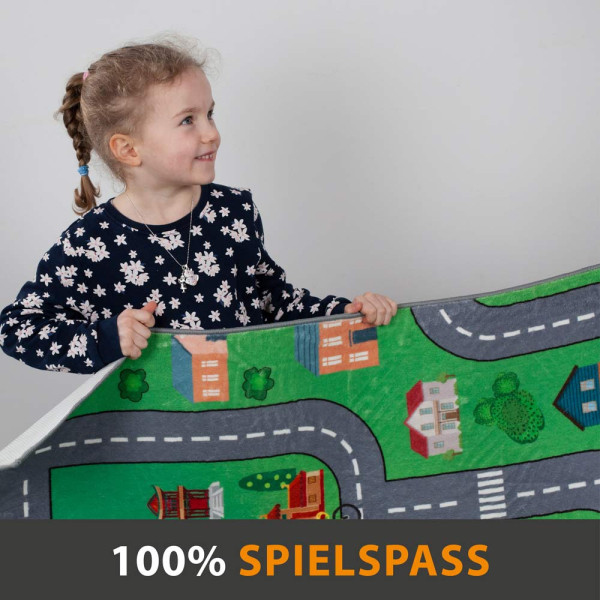 Spielteppich mit bunten Motiven einer Stadt, Straßen, Fahrzeugen und Spielplätzen, die Kindern das Spielen und Entdecken ermöglichen.