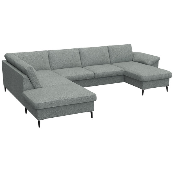 Gemütliches Ecksofa in einem gedeckten Grünton mit breiten Armlehnen. Das Sofa bietet viel Platz und ist ideal für entspannte Stunden im Wohnzimmer.
