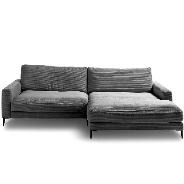 Graues Cordsofa Uptown ST2 in L-Form mit Chaiselongue auf der rechten Seite steht auf schlanken schwarzen Beinen und bietet eine gemütliche Sitzgelegenheit.
