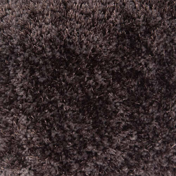Schwarzer Hochflorteppich mit weichem, kuscheligem Flor, der am Rand gefasst ist. Der Teppich ist in einem modernen Design gestaltet und eignet sich für individuelle Raumgestaltungen.