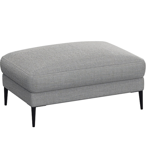 Grauer Polsterhocker Belle steht auf schlanken schwarzen Beinen und hat eine abgerundete Sitzfläche. Der Hocker wird als Ergänzung zum Sofa Belle angeboten.