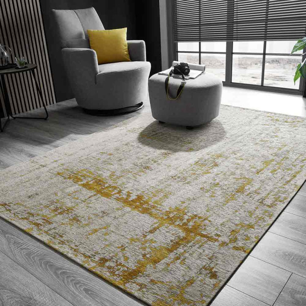 Moderner Teppich Stratos in Creme-Grau mit strukturierter Oberfläche. Er zeigt gelbe und goldene Farbtöne, die ihm ein einzigartiges Design verleihen. Er eignet sich für verschiedene Raumgestaltungen.