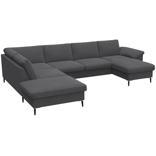 Gemütliches Ecksofa in einem gedeckten Grünton mit breiten Armlehnen. Das Sofa bietet viel Platz und ist ideal für entspannte Stunden im Wohnzimmer.