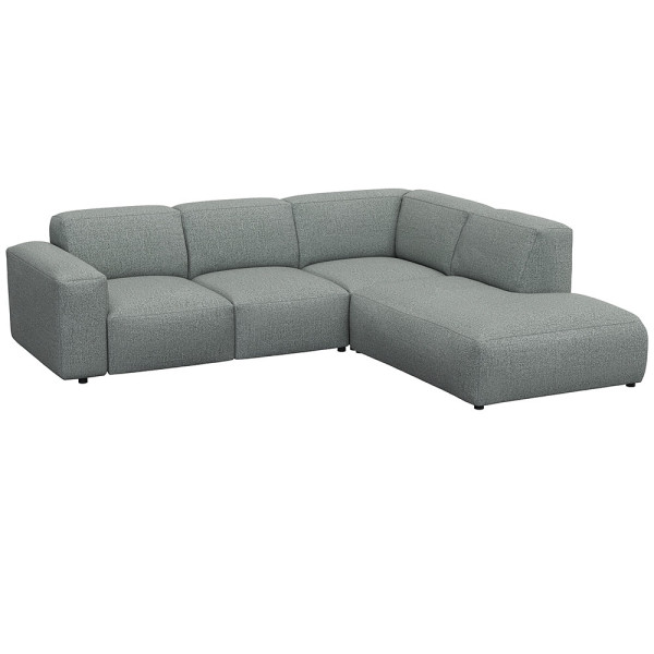 Graues, modulares Sofa LUCERA mit offener Ecke steht dekorativ. Es bietet bequeme Sitzmöglichkeiten und passt sich dem Raumdesign an. Ideal für eine stilvolle Inneneinrichtung.