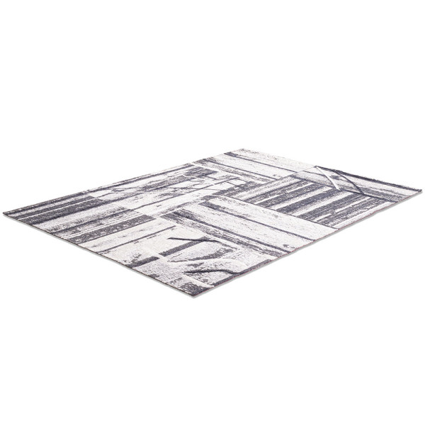 Grauer Teppich Keitum SA010 mit geometrischem Muster aus verschiedenen Holzdesigns. Er dient der Dekoration und sorgt für eine gemütliche Atmosphäre in Innenräumen.