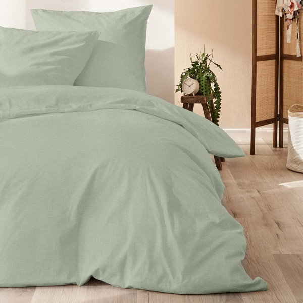 Olivefarbene Bettwäsche aus Halbleinen besteht aus einem Kissenbezug und einem Bettbezug. Die Materialien sind weich und gemütlich, ideal für einen angenehmen Schlaf.