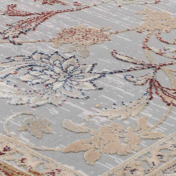 Grauer Kurzflorteppich mit multicolor Design zeigt florale Muster in sanften Farben. Vorteilhaft für eine stilvolle Raumgestaltung, bietet er Komfort und Ästhetik in jedem Wohnambiente.