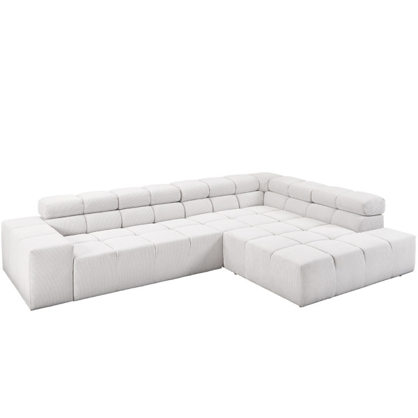 Moderne, L-förmige Couchgarnitur aus feinem Cord in heller Farbe. Sie bietet Polsterkomfort und besteht aus quadratischen Elementen. Ideal für eine stilvolle Wohnzimmereinrichtung.