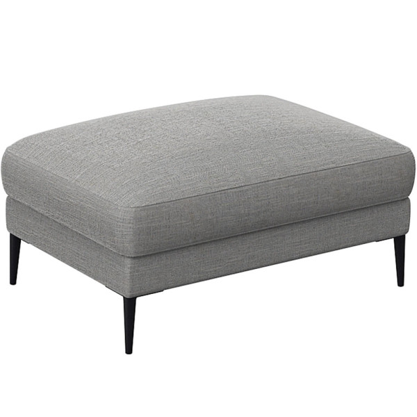 Grauer Polsterhocker Belle steht auf schlanken schwarzen Beinen und hat eine abgerundete Sitzfläche. Der Hocker wird als Ergänzung zum Sofa Belle angeboten.