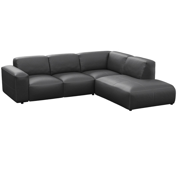 Graues, modulares Sofa LUCERA mit offener Ecke steht dekorativ. Es bietet bequeme Sitzmöglichkeiten und passt sich dem Raumdesign an. Ideal für eine stilvolle Inneneinrichtung.