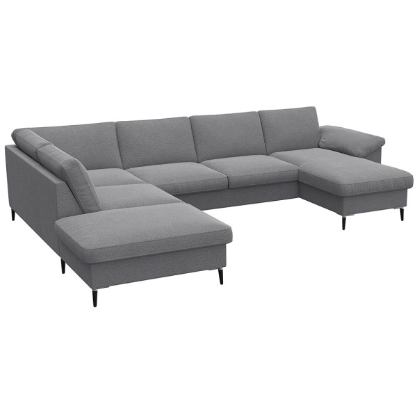 Gemütliches Ecksofa in einem gedeckten Grünton mit breiten Armlehnen. Das Sofa bietet viel Platz und ist ideal für entspannte Stunden im Wohnzimmer.
